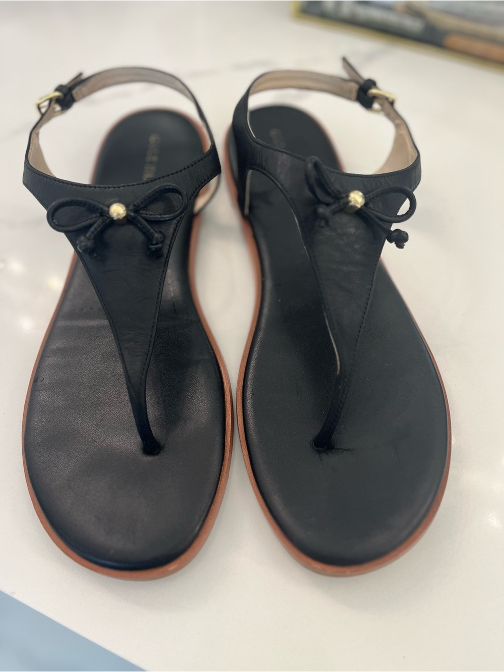 Cole Haan Black Leather T-Strap Sandals with Bow and Gold Accent